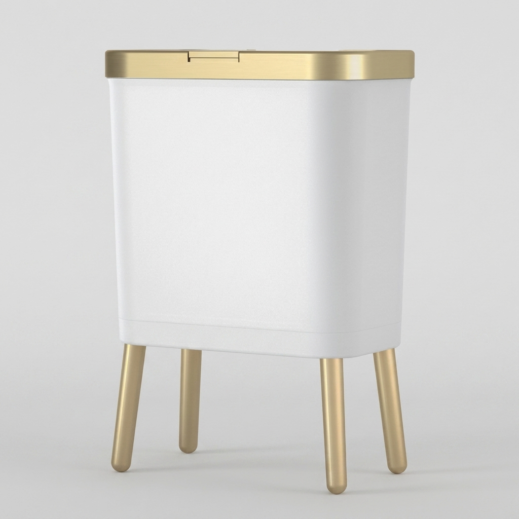 A modern white rectangular side table or stool with a brushed gold metal top trim and four tapered gold legs, shown on a light gray studio background.