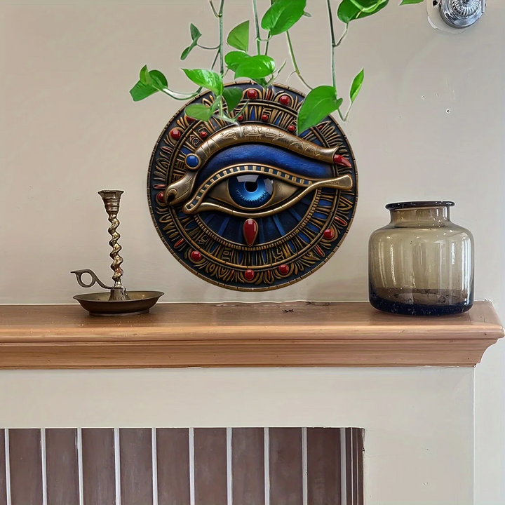 Decorative wall piece with eye design on a shelf with plants and jars.