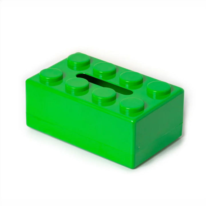 Green toy brick with a slot on a white background