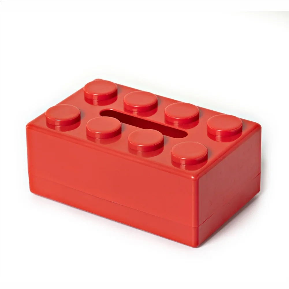 Red toy brick on a white background