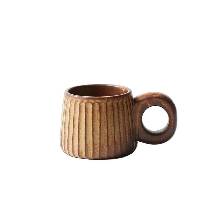 Brown ceramic mug with ribbed texture on a white background