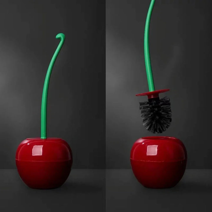 A split-screen view of a glossy red cherry-shaped toilet brush holder with a green stem and brush. The left side shows the closed holder with the green stem curved upward.