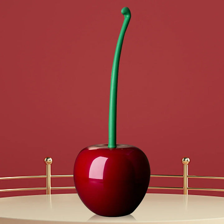 Red cherry with a green stem on a red background