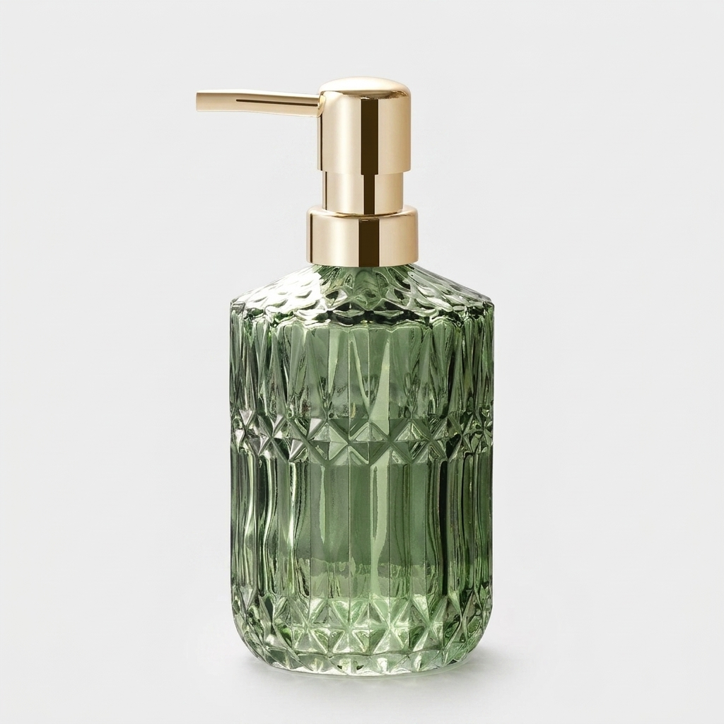 A green faceted glass pump bottle with a gold metallic dispenser, shown on a light gray background.