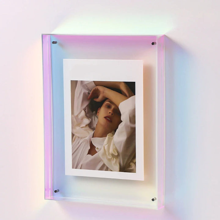 Framed photograph of a person with a colorful, gradient frame on a light background