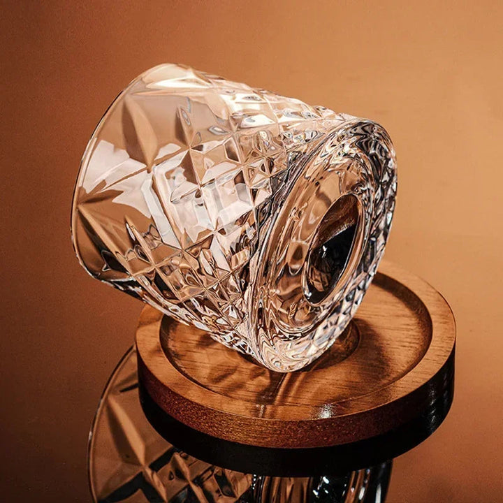 Crystal glass object on a wooden stand against a brown background