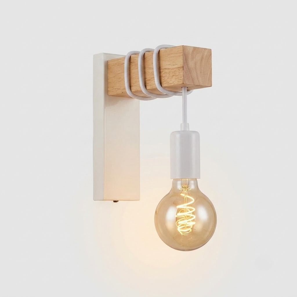 A modern wall-mounted light fixture with a natural wood block, white metal bracket, and a hanging clear glass bulb with a visible spiral filament, shown against a light gray background.