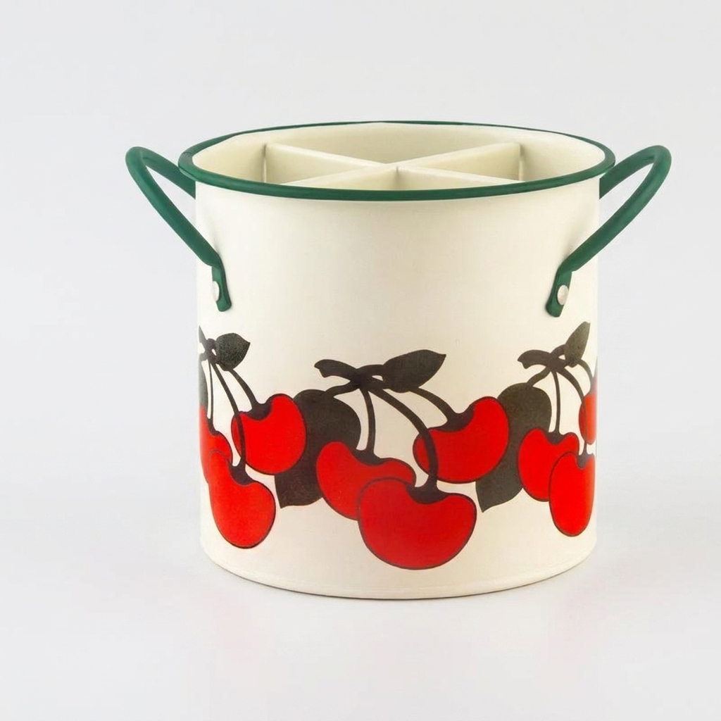 An off-white ceramic can cooler with a red and black cherry pattern and dark green handles, shown on a light gray background.