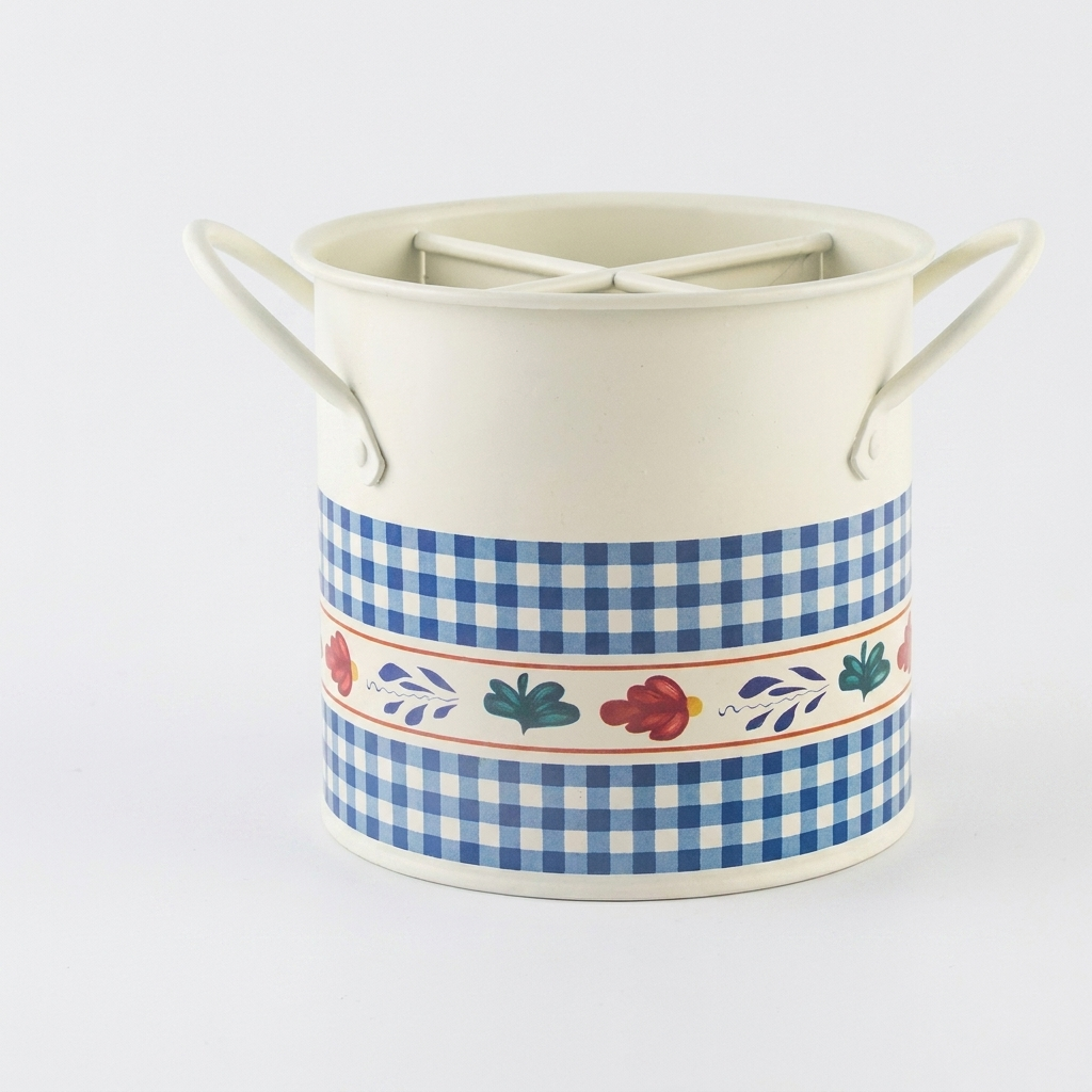 An off-white ceramic canister with two side handles, featuring a blue and white gingham pattern and a central floral border band, set against a plain white background.