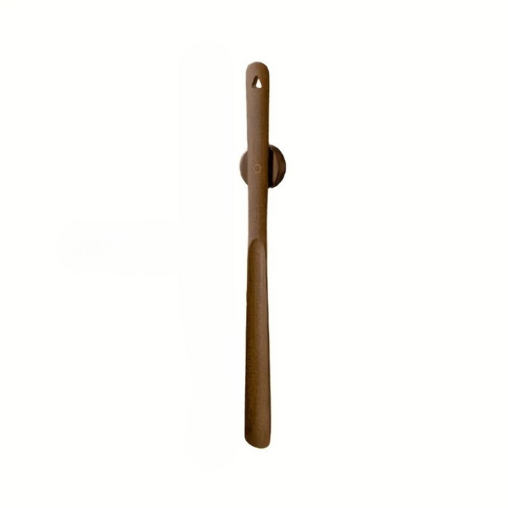 A single brown wooden tool with a long handle and a circular mounting plate, shown against a plain white background.