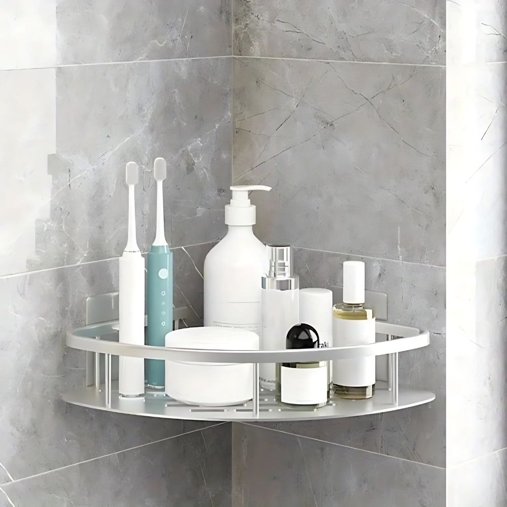 Corner shelf with bathroom products against a tiled wall
