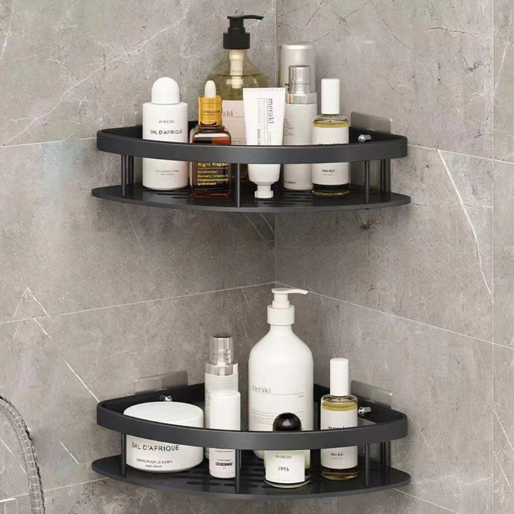 Corner shower caddy with various bottles on a tiled wall