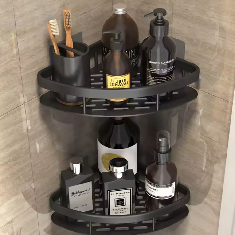 Corner shower caddy with various bottles and toiletries on a tiled wall background