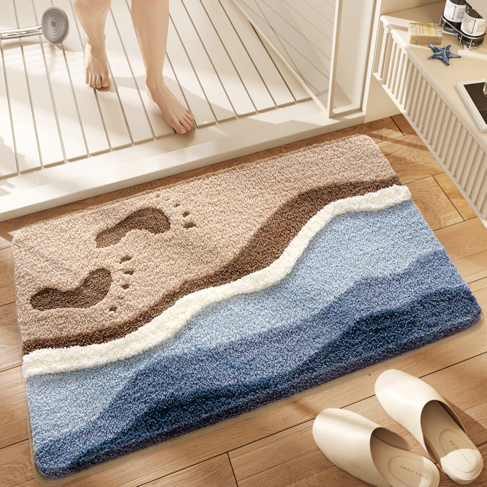 Decorative bath mat with wavy design on a wooden floor, next to a shower and slippers.