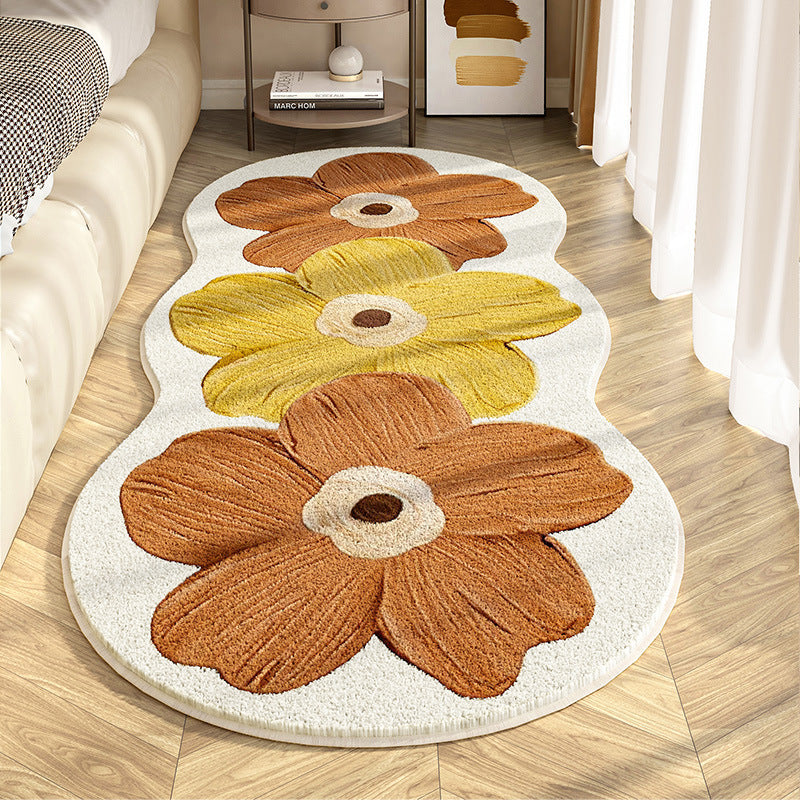 Floral-patterned rug on a wooden floor in a living room setting