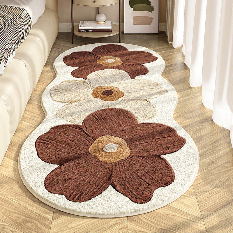 Floral-patterned rug on a wooden floor with a neutral color scheme