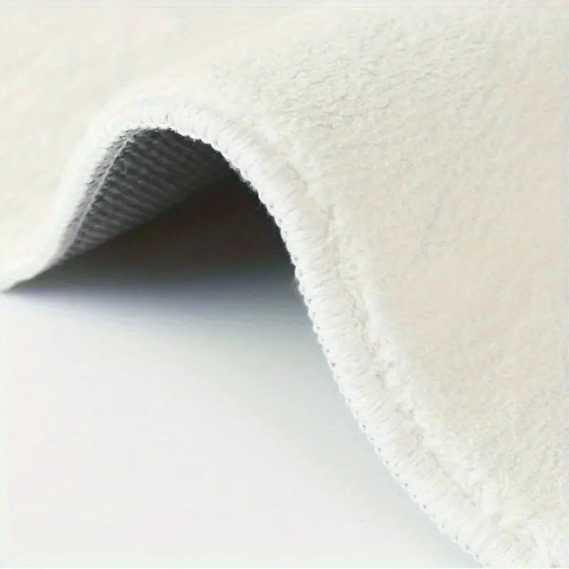 Close-up of textured white fabric on a light gray background