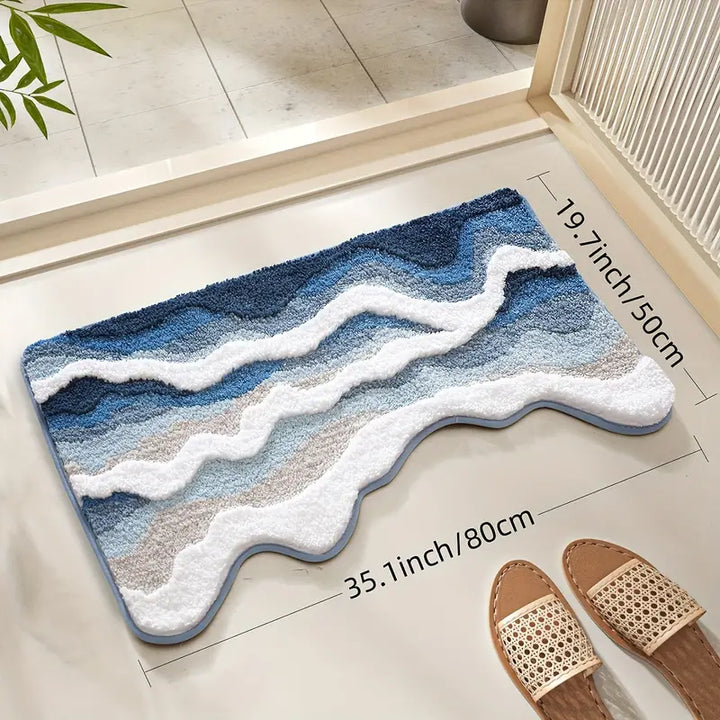 Blue and white textured rug on a wooden floor with slippers and a plant.