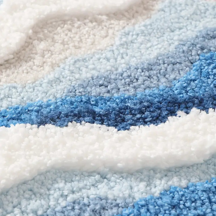 Close-up of textured blue and white fabric with a wavy pattern