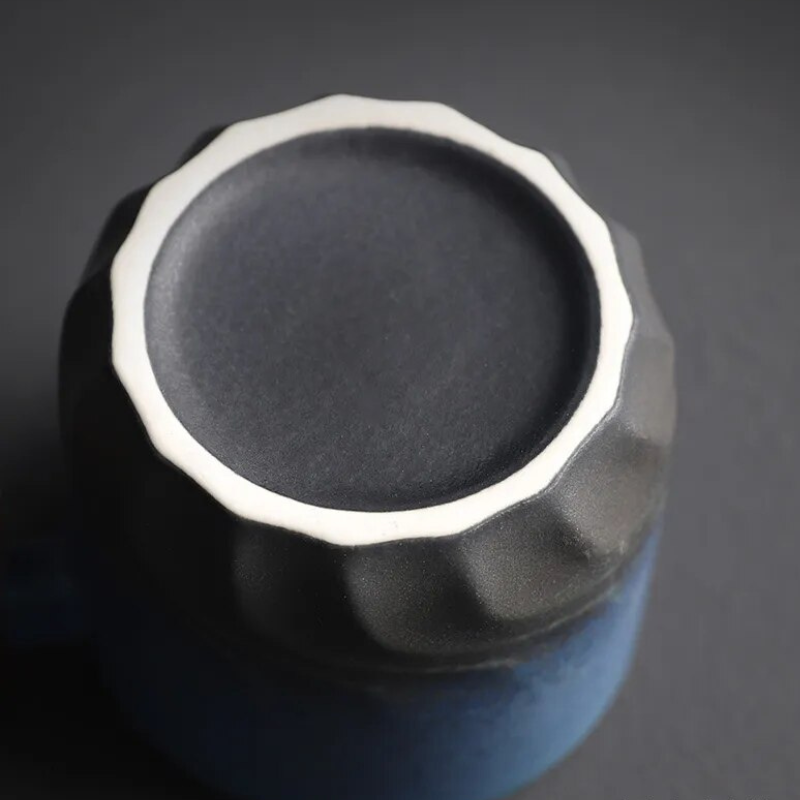Close-up of a metallic knob on a dark background