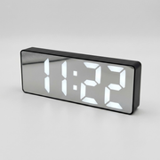 A rectangular digital clock with a glossy black frame and mirrored face, displaying the time 11:22 in bright white LED digits against a light gray background.