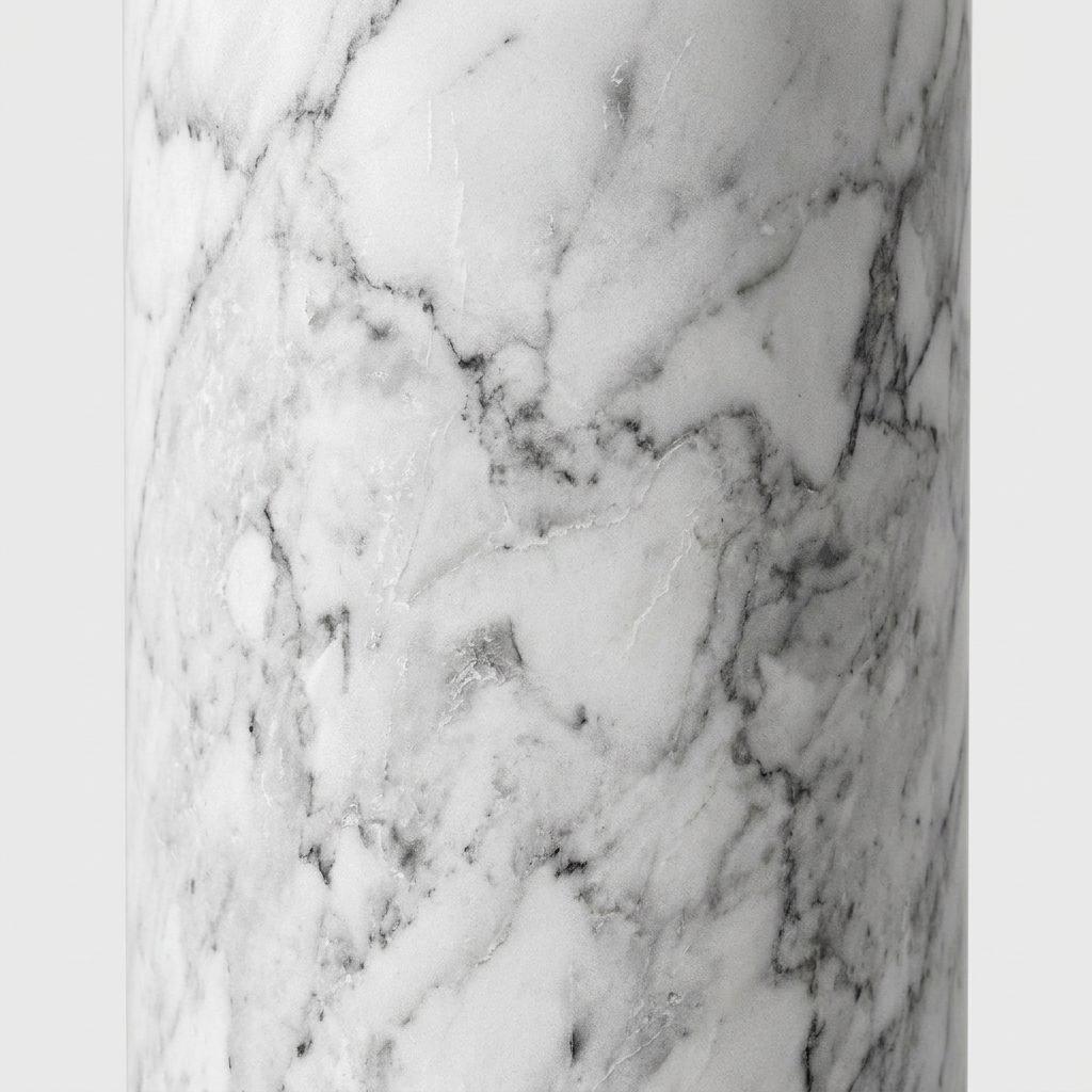 A close-up of a white marble surface with natural gray veining and a glossy finish.