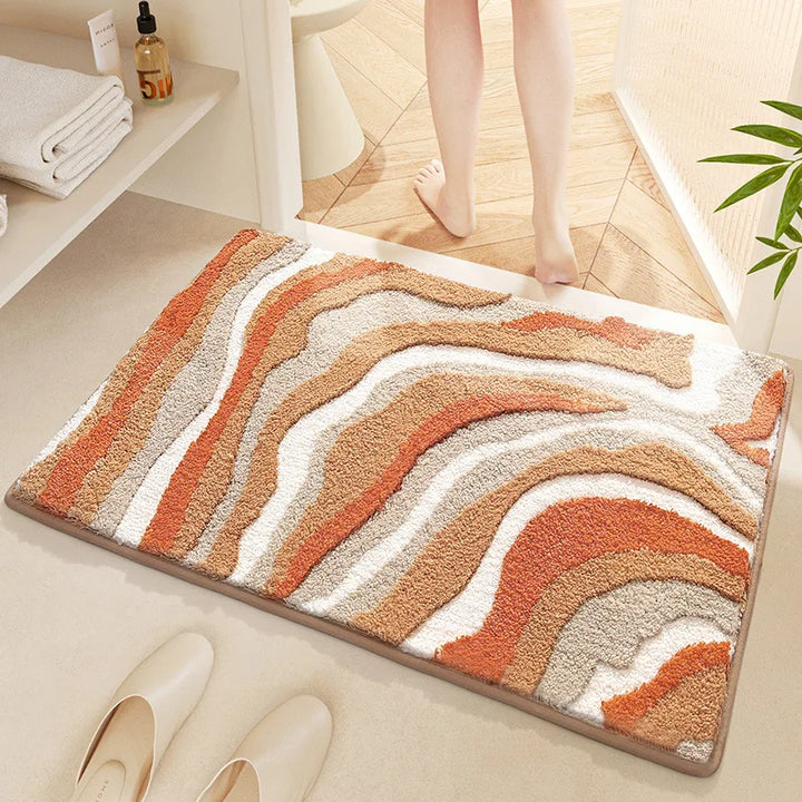 Decorative bath mat with wavy pattern on a bathroom floor
