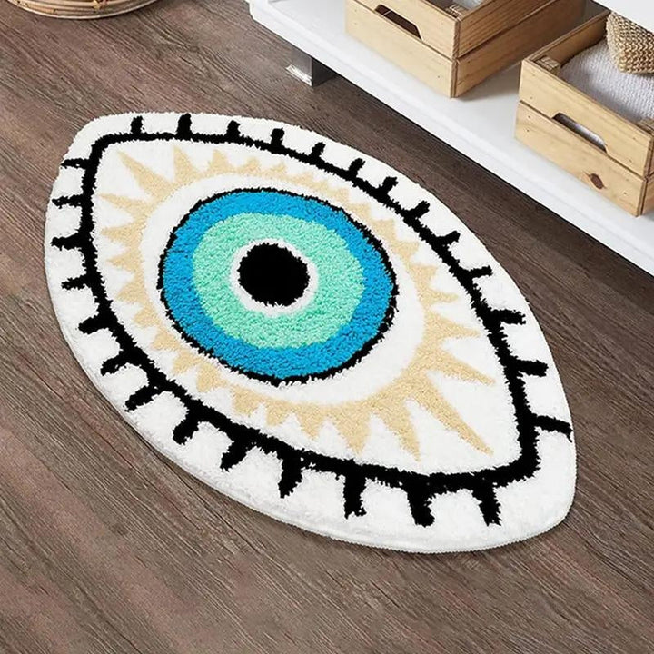 Eye-shaped rug with blue center and black outline on a wooden floor