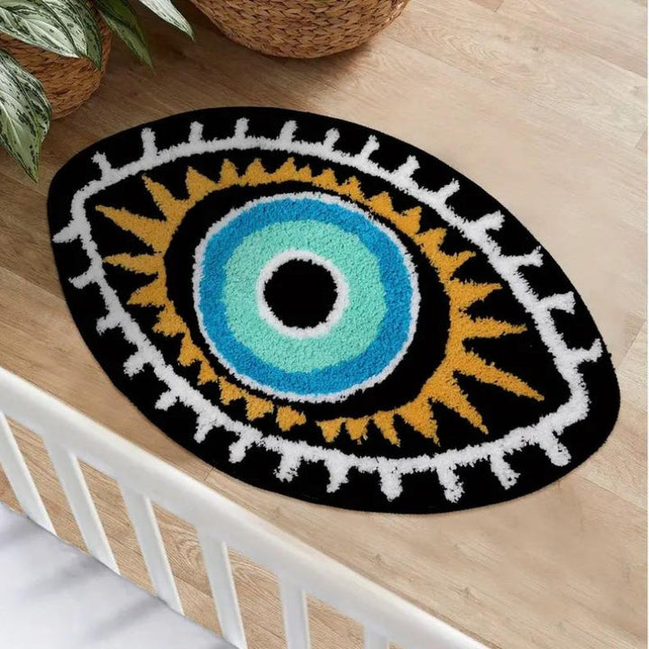 Decorative rug with eye design on a wooden floor