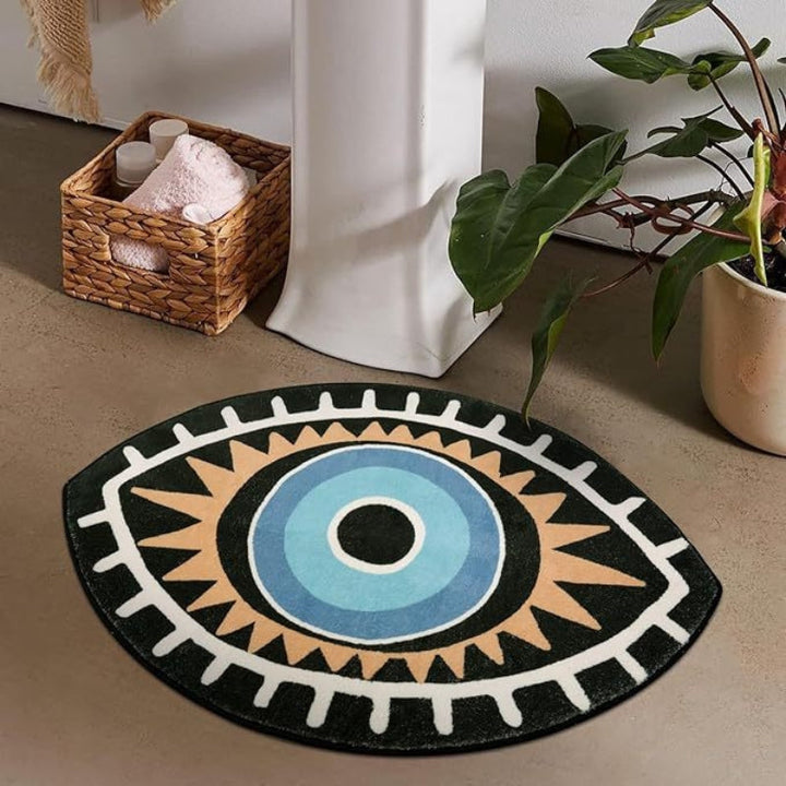Decorative round rug with geometric pattern on a floor, next to a basket and plant.