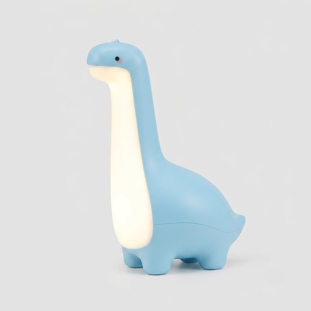 A dinosaur-shaped night light in light blue with a warm white glowing belly, photographed on a neutral light gray background.