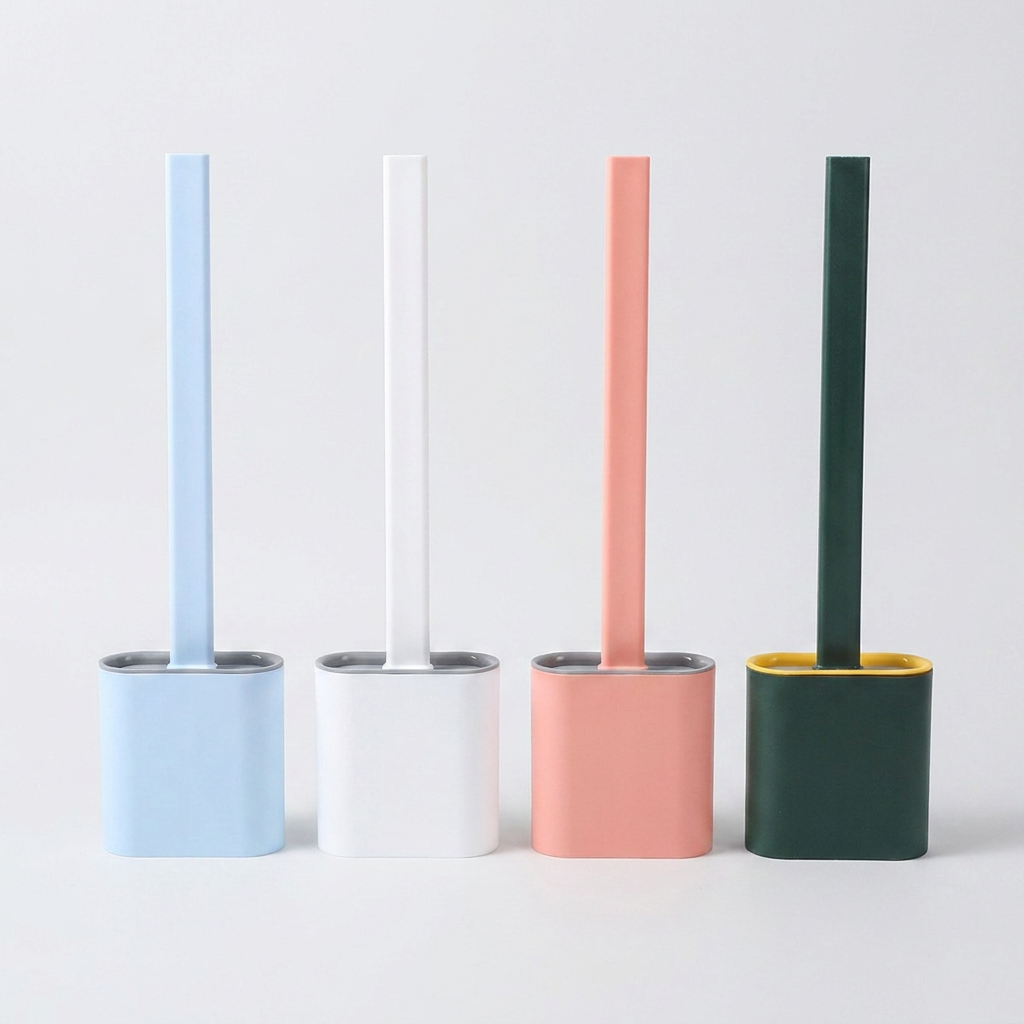 Four minimalist toilet brush holders with matching handles in light blue, white, pink, and dark green, arranged side by side on a light gray background.