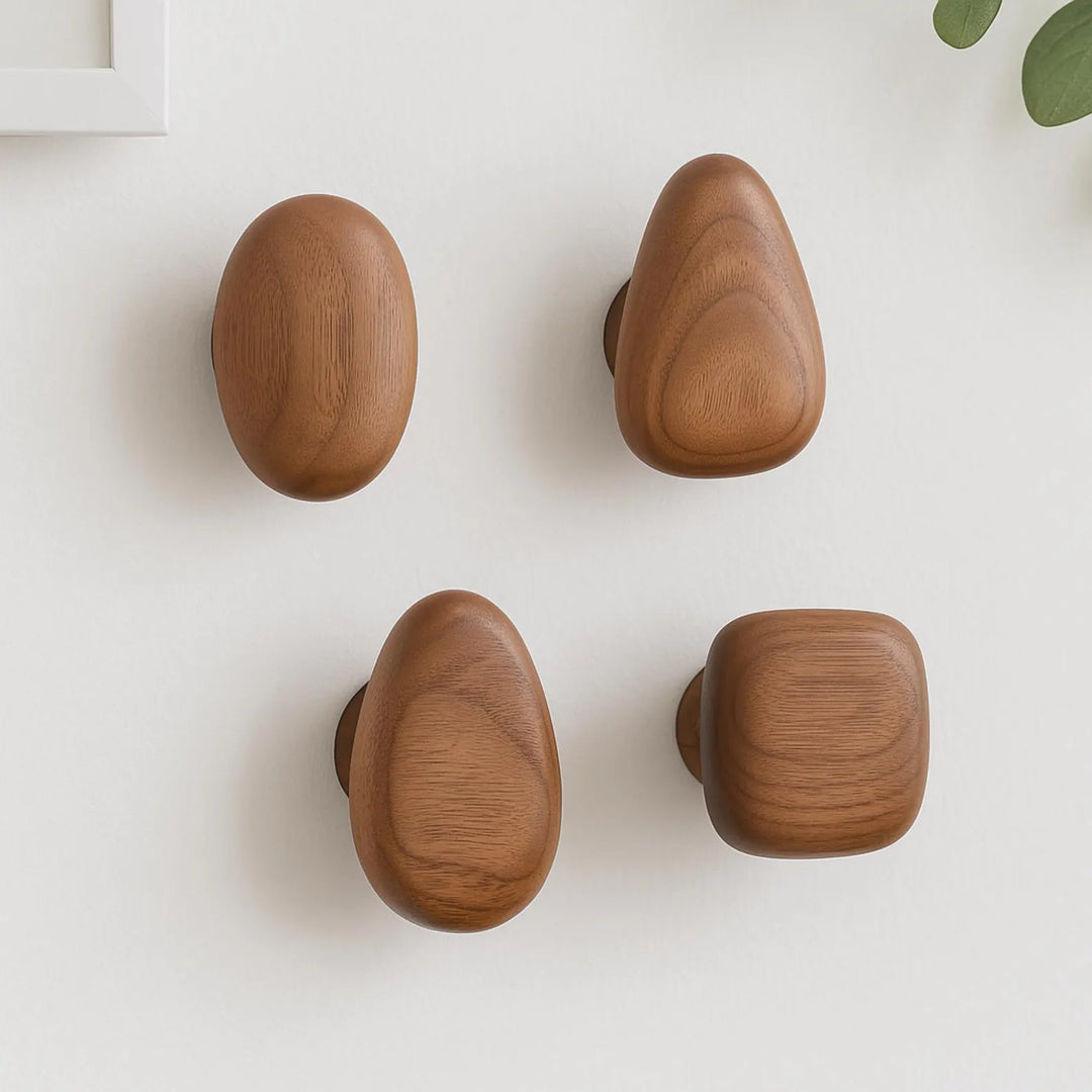 Four wooden knobs on a white background