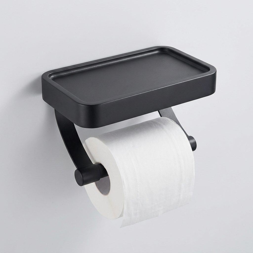 A matte black wall-mounted toilet paper holder with an integrated rectangular tray above a roll of toilet paper, shown against a plain light gray wall.